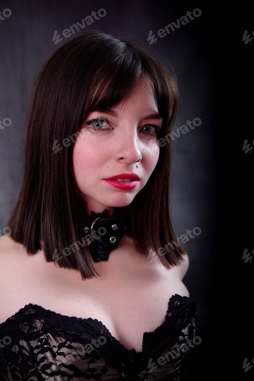 Preview: Attractive Young Woman In Victorian Style Corset And Necklace, Studio Shot