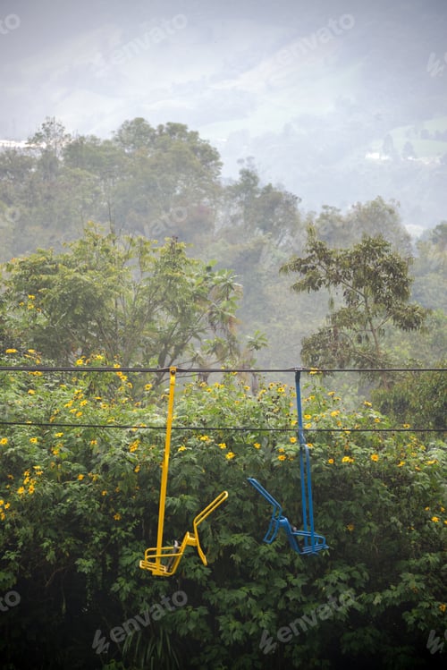 Preview: Yellow And Blue Chairs Of A Chair Lift In A Cloud Forest Near Manizales, Colombia