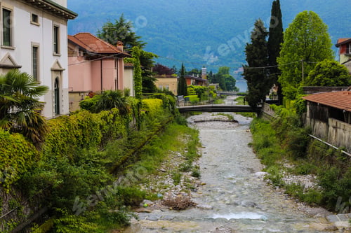 Preview: Amazing Italian Town Mandello With Lovely Houses, Trees And Alps In Background. Concept Of