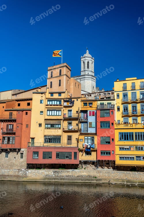 Preview: Girons, Spain With Colorful Buildings, Cathedral, And Catalan Flag