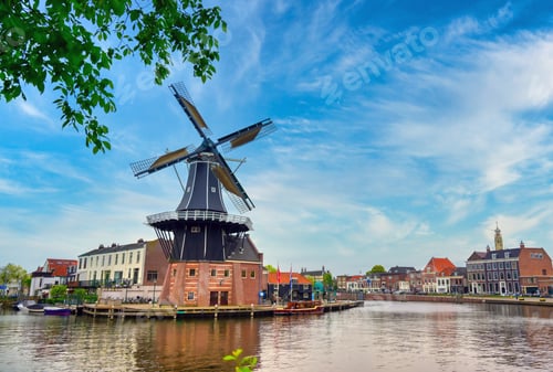Preview: A Windmill Along The Canals In Haarlem, Netherlands On A Clear Day.