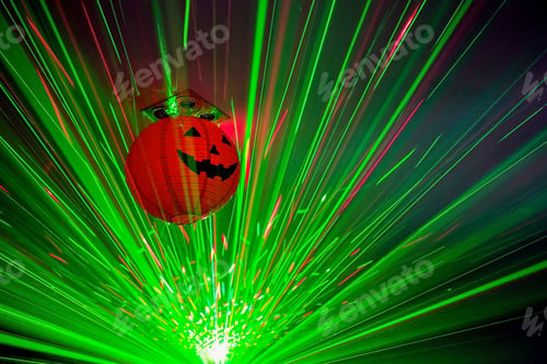 Preview: A Halloween Party Decorated With Lasers And A Pumpkin On The Ceiling.