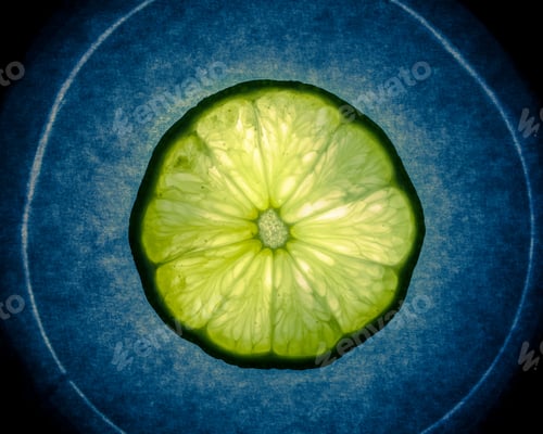 Preview: Cross Section Slice Of Lime Against Dark Textured Background