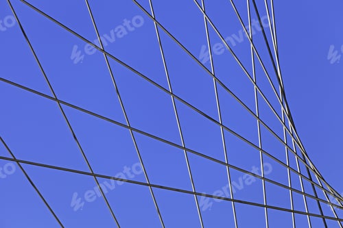 Preview: Modern architecture featuring geometric lines against blue sky