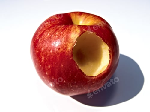 Preview: An Apple With A Round Hole Carved Into It As A Metaphor For The Mythical Forbidden Fruit.