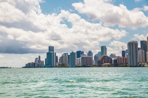 Preview: Miami Florida Skyline Across Bay On A Sunny Day With Clouds Overhead
