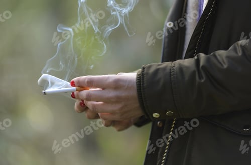 Preview: Woman Smoking And Sending Messages By Cell Phone