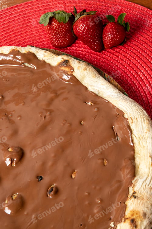 Preview: Chocolate Pizza with Strawberries on a Red Placemat