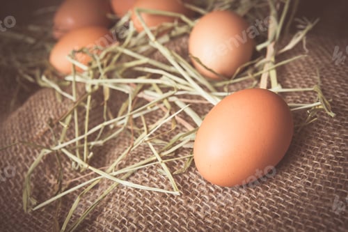 Preview: Farm Fresh Brown Eggs And Straw With Vintage Filter Effect.