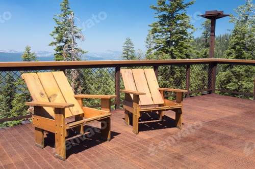 Preview: Two Wood Chairs On Outdoor Sunny Deck With Mountains In The Background