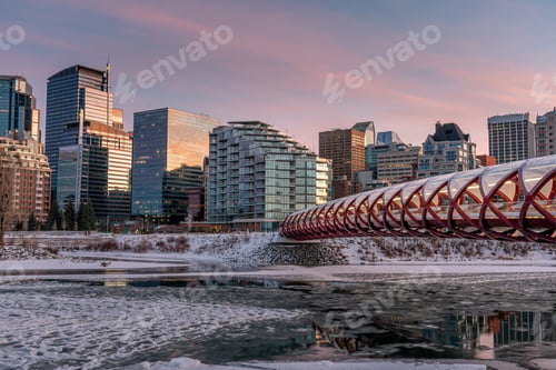 Preview: Evening Skyline View Along The Bow River In Calgary, Alberta. Peace Bridge Visible.