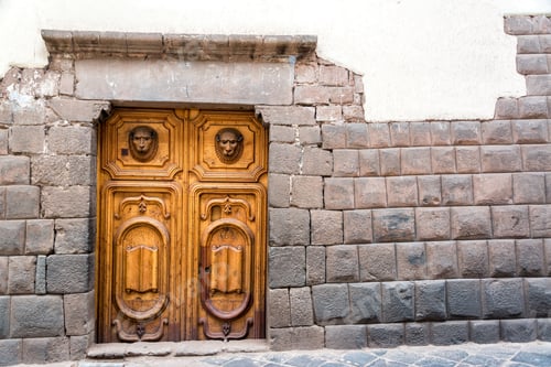 Preview: Inca Stonework With A Beautiful Carved Wooden Door In Cusco, Peru