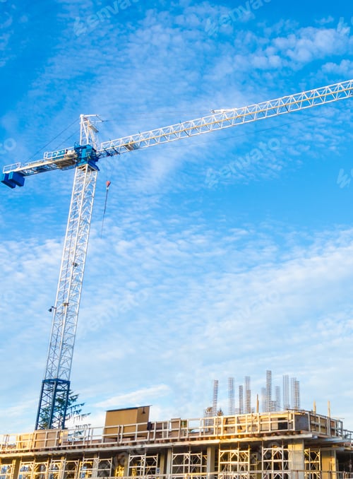 Preview: High-Rise Building Under Construction. The Site With Crane Against Blue Sky With White Clouds.