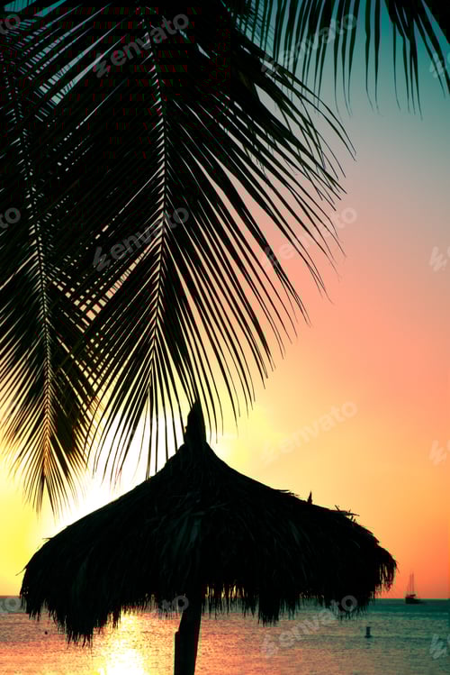 Preview: Tropical Sunset With Silhouetted Palapa Grass Hut And Palm Trees