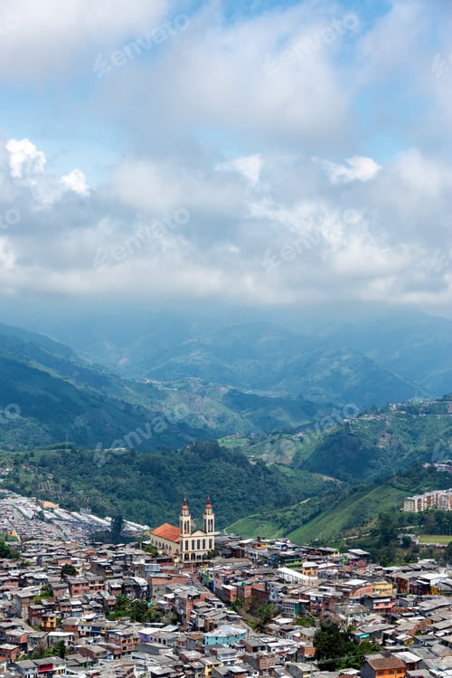 Preview: Vertical View Of A Church Towering Over A Neighborhood In Manizales, Colombia