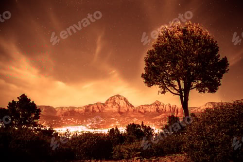 Preview: Beautiful Night Scene From Sedona Arizona With Mountain Rock Formations And City Lights