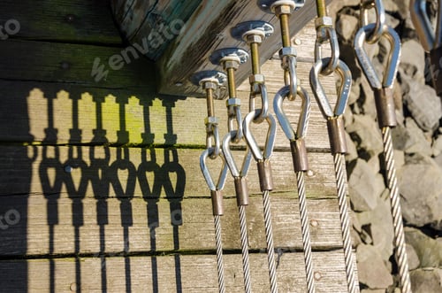 Preview: Abstract View Of A Fence Casting Deep Shadows