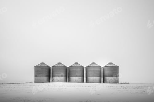 Preview: Five Grain Bins On A Cold Winter Day.