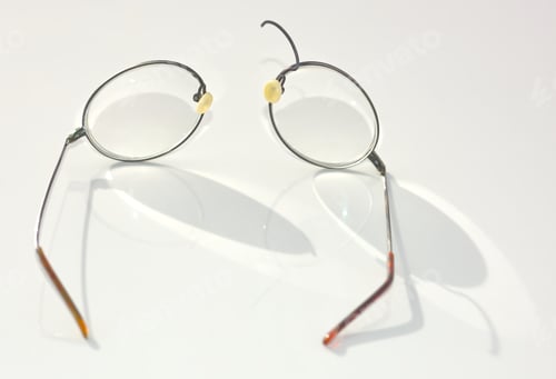 Preview: A Pair Of Titanium Wire Rim Eye Glasses That Have Broken And Split Apart On The Nose Bridge Section.