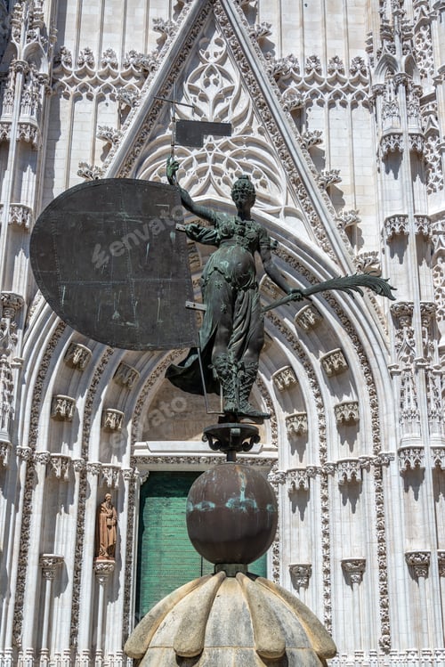 Preview: Statue Of Giraldillo In Front Of The Massive Gothic Cathedral In Sevilla, Spain