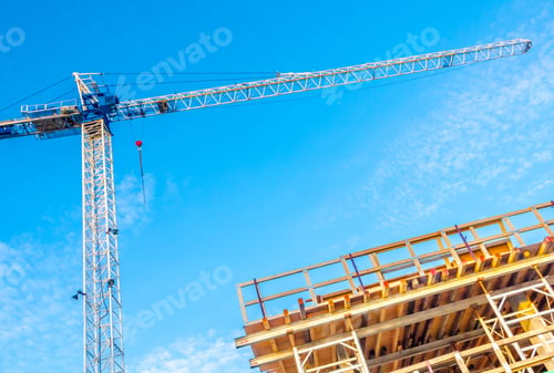 Preview: High-Rise Building Under Construction. The Site With Crane Against Blue Sky With White Clouds.