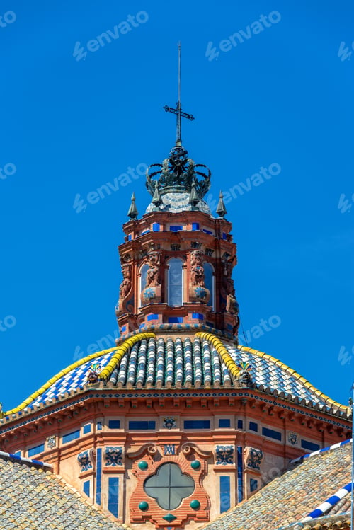 Preview: View Of A Colorful Ornate Dome With A Beautiful Blue Sky In Historic Seville, Spain