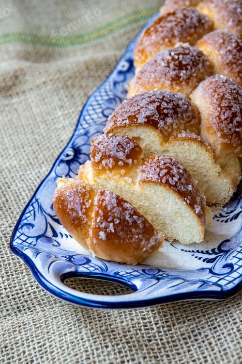 Preview: Sweet Twist Bread, Typical Of Brazilian Bakery, On Dish Decorated In Blue On Rustic Jute Tablecloth
