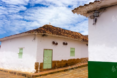 Preview: Colonial Building On A Street Corner With Large Ants On The Wall In Barichara, Colombia
