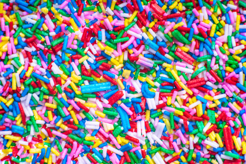 Preview: Colorful Candy Sprinkles Close Up For Birthday Cake On White Background