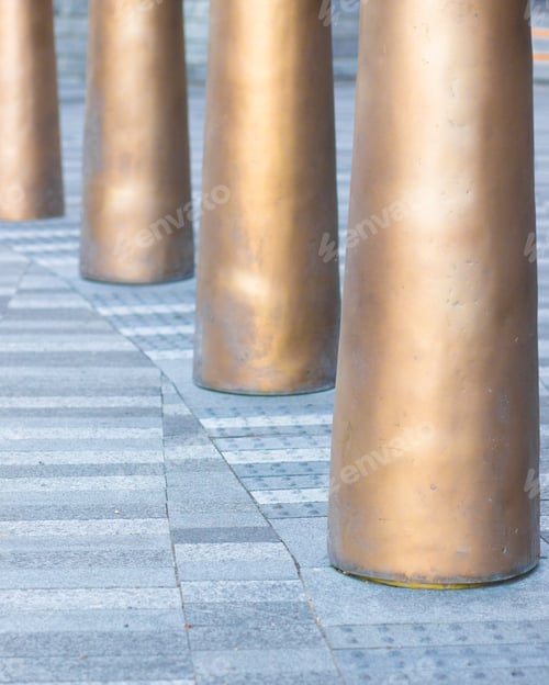 Preview: Cement Pavers And Metal Poles In Urban Plaza