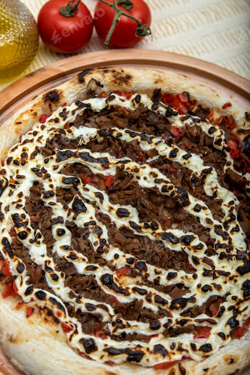 Preview: Shimeji Mushroom And Cream Cheese Pizza And Cooking Ingredients: Tomatoes And Olive Oil On Table
