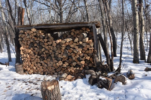 Preview: Pile Of Wood Stacked In Winter Cabin