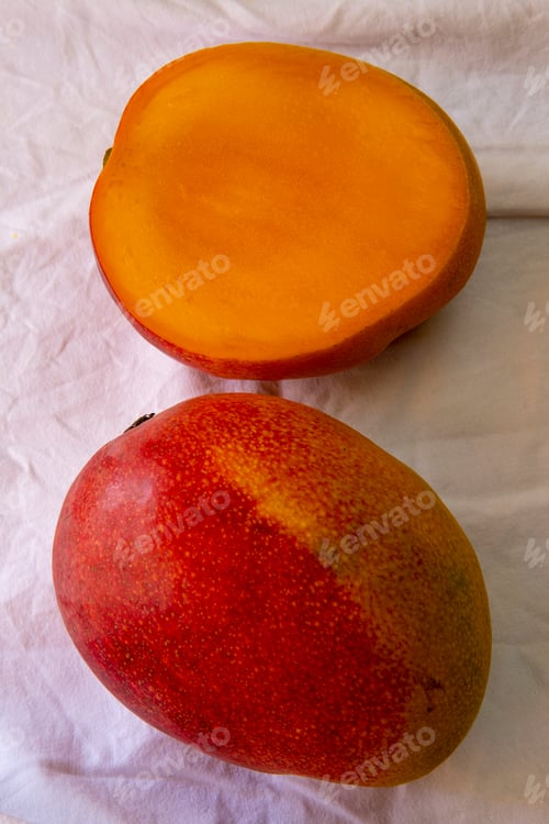 Preview: Sliced Mango On White Wrinkled Tablecloth