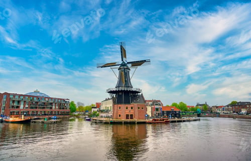 Preview: A Windmill Along The Canals In Haarlem, Netherlands On A Clear Day.