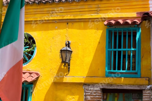 Preview: Colorful Colonial Architecture In Cartagena, Colombia With An Italian Flag In The Foreground