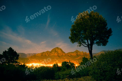 Preview: Beautiful Night Scene From Sedona Arizona With Mountain Rock Formations And City Lights