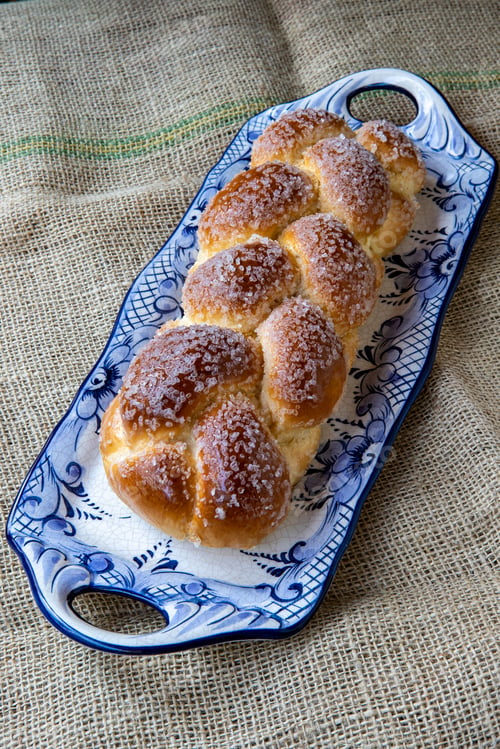 Preview: Sweet Twist Bread, Typical Of Brazilian Bakery, On Dish Decorated In Blue On Rustic Jute Tablecloth