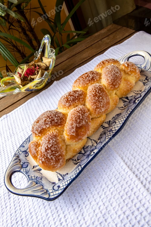 Preview: Sweet Twist Bread, Typical Of Brazilian Bakery, On Dish Decorated In Blue On White Tablecloth