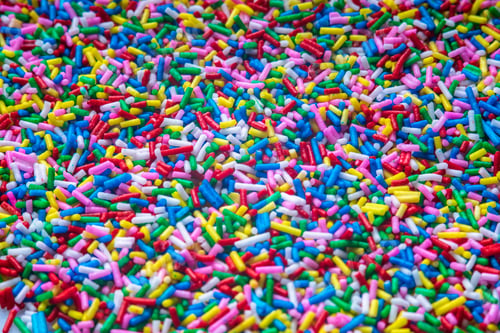 Preview: Colorful Candy Sprinkles Close Up For Birthday Cake On White Background