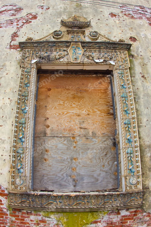 Preview: A Boarded Up Window On A Ornate Urban Building