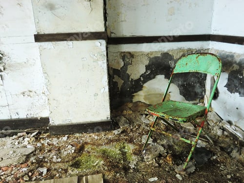 Preview: Lonely Dirty Green Chair Inside Abandoned Grungy Room - Landscape Color Photo