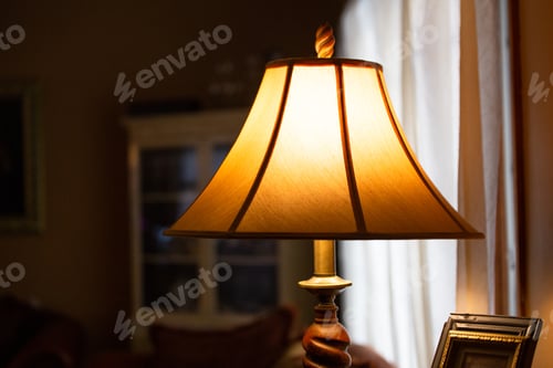 Preview: Illuminated Lamp With Shade In A Dimly Lit Room