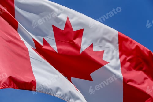 Preview: Flag Of Canada Waving On The Wind With Blue Sky