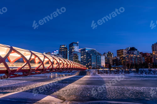 Preview: Evening Skyline View Along The Bow River In Calgary, Alberta. Peace Bridge Visible.