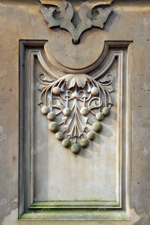 Preview: Color Dslr Image Of Relief Carving In Concrete Of A Stylized Bunch Of Grapes; In Vertical