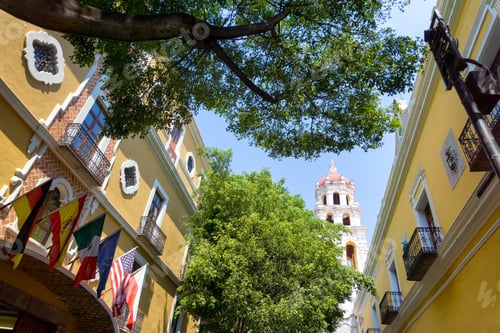 Preview: View Of Yellow Colonial Building With Church In Puebla, Mexico