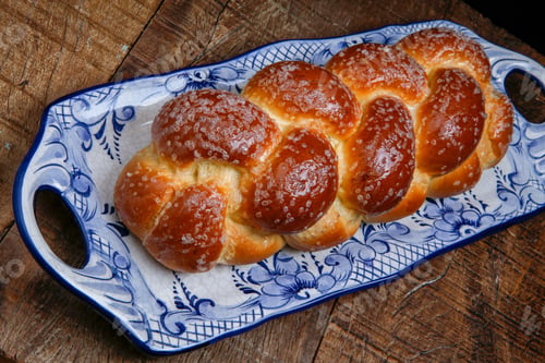 Preview: Sweet Twist Bread, Typical Of Brazilian Bakery, On Dish Decorated In Blue In Rustic Wooden Table