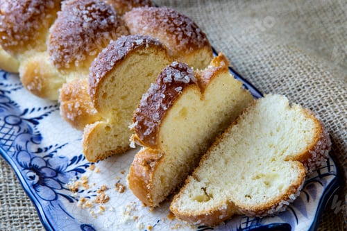 Preview: Sweet Twist Bread, Typical Of Brazilian Bakery, On Dish Decorated In Blue On Rustic Jute Tablecloth