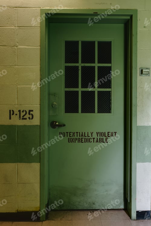 Preview: A Green Painted Door Inside An Abandoned Prison / Jail.