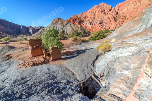 Preview: Ruined Adobe Building Next An Abandoned Copper Mineshaft With Red Hills In The Background Of The